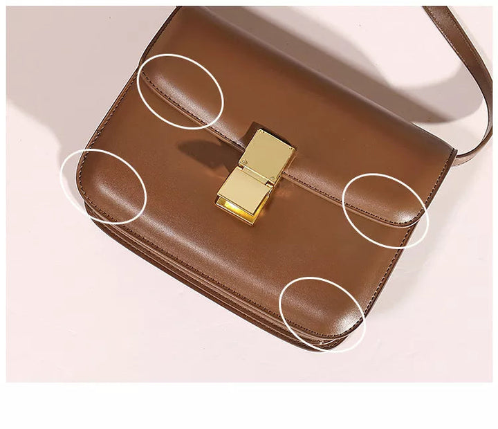 Stilren design av elegant dam axelväska. Perfekt messengerväska i tidlös designerstil.