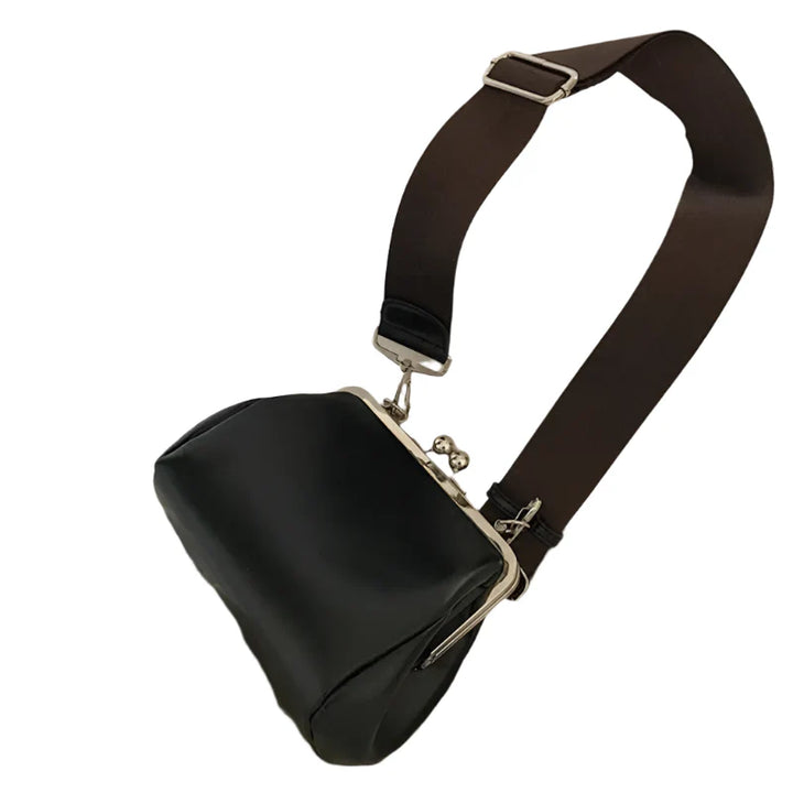Elegant dam crossbody väska i svart PU-läder med stilrent läpplås. Perfekt axelväska för kvinnor.