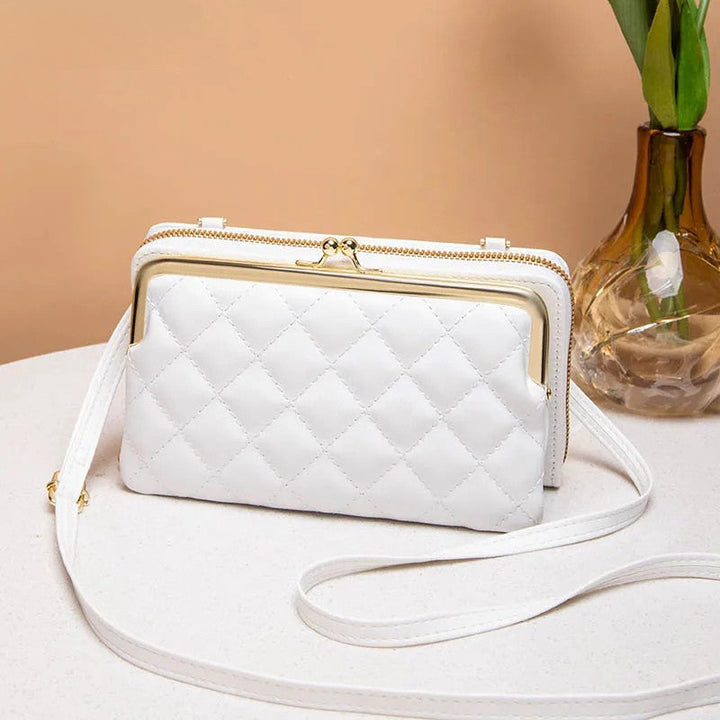 Praktisk crossbody väska för dam, med organiserade fack. En modern vardagsväska som håller ordning.