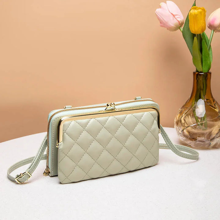 Kompakt dam crossbody väska med justerbar rem. En stilren och praktisk vardagsväska för väsentligheter.