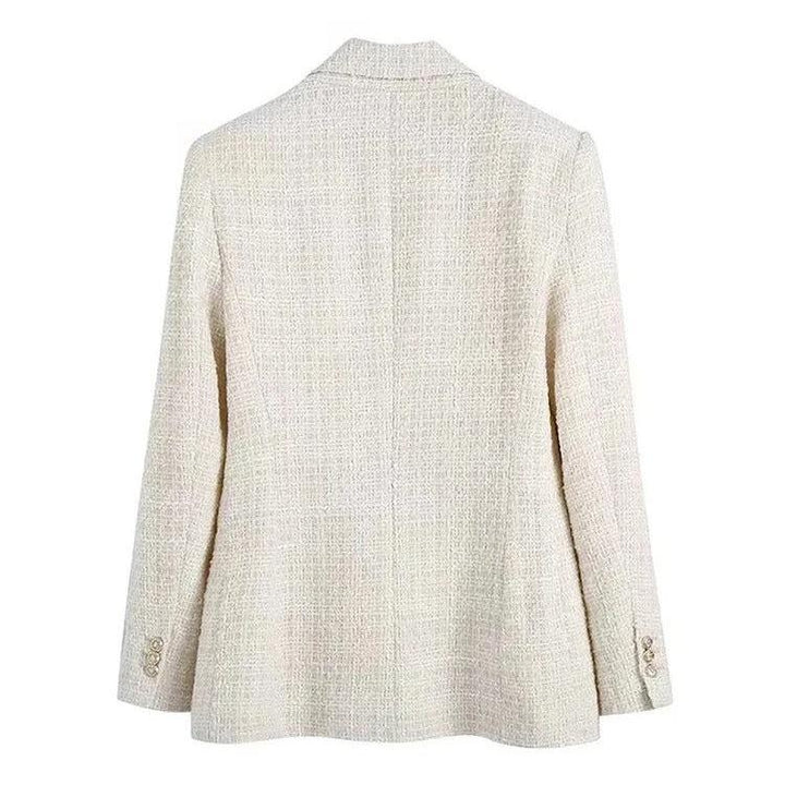 Stilren dubbelknäppt dam kavaj för en formell men bekväm look. Mångsidiga kvinnokläder.