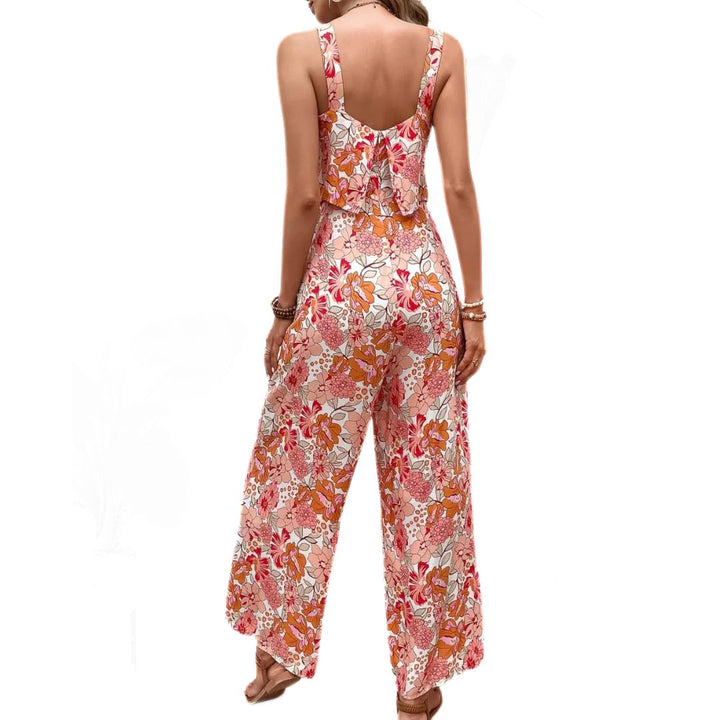 Blommig vintage jumpsuit för dam, ärmlös design, idealisk för både fest och vardag, sommar mode.