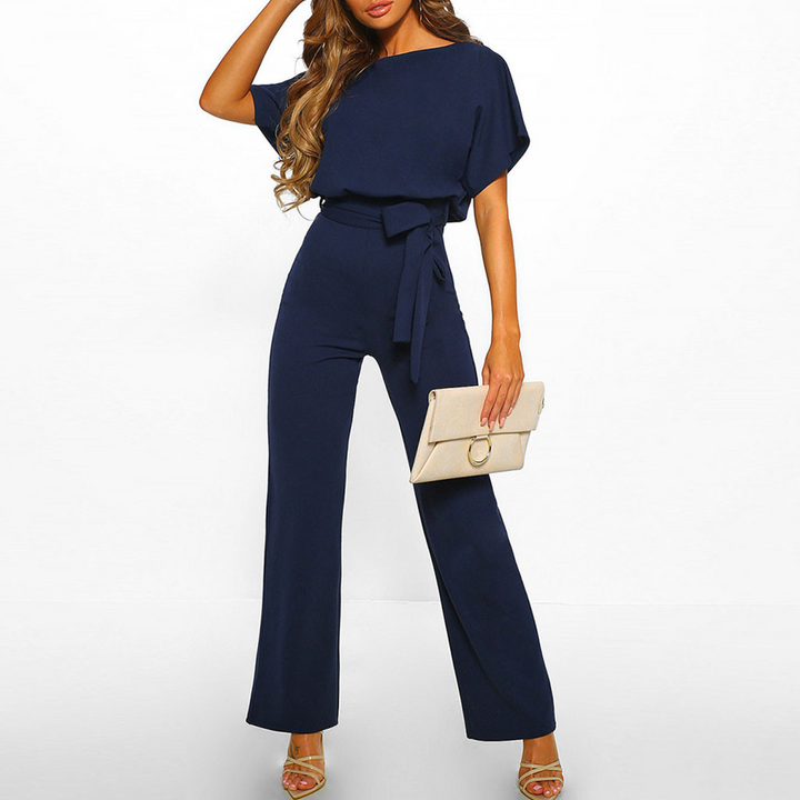 Stilfull och bekväm dam jumpsuit med vida ben och kort ärm. Perfekt för både arbete och fritid.
