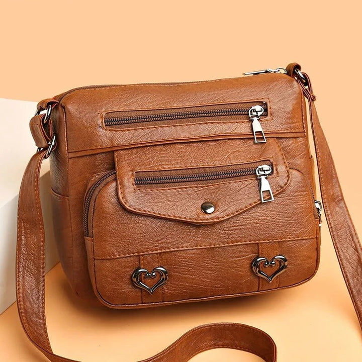 Elegant dam messenger-väska, rymlig och stilren. Perfekt vardagsväska med justerbar rem.