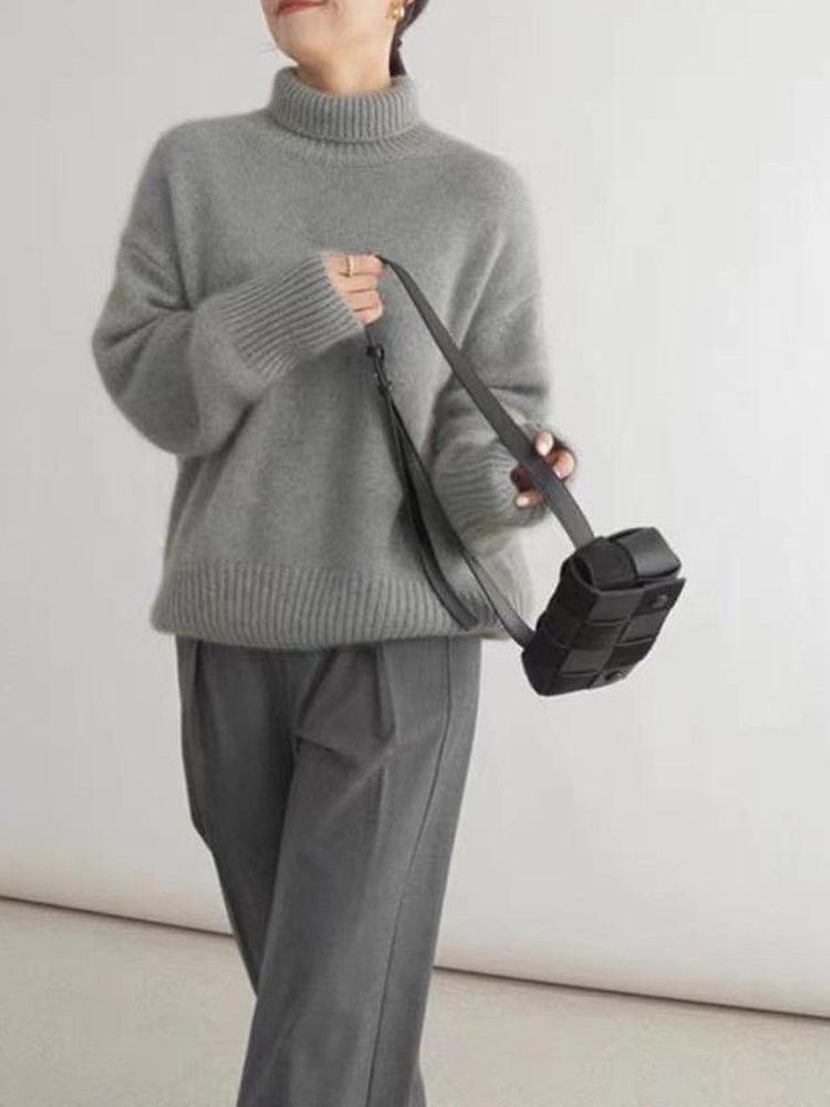 Klassisk dam rollkragepullover, en tidlös tröja för kvinnor. Bekväm, varm och elegant för alla tillfällen.