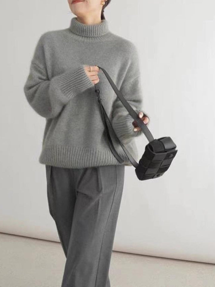 Klassisk dam rollkragepullover, en tidlös tröja för kvinnor. Bekväm, varm och elegant för alla tillfällen.