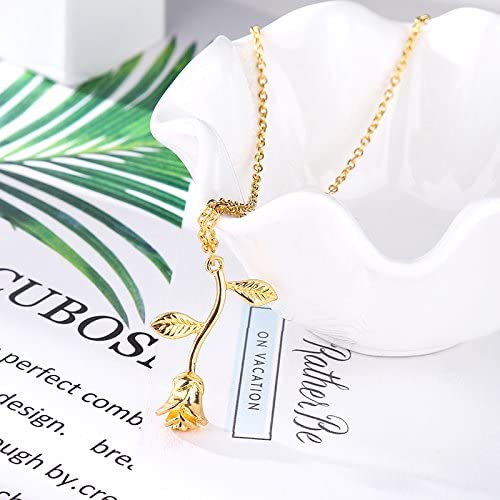 Stilrent damhalsband med hänge av ros. Accessoar i guld och silver, perfekt för elegans.
