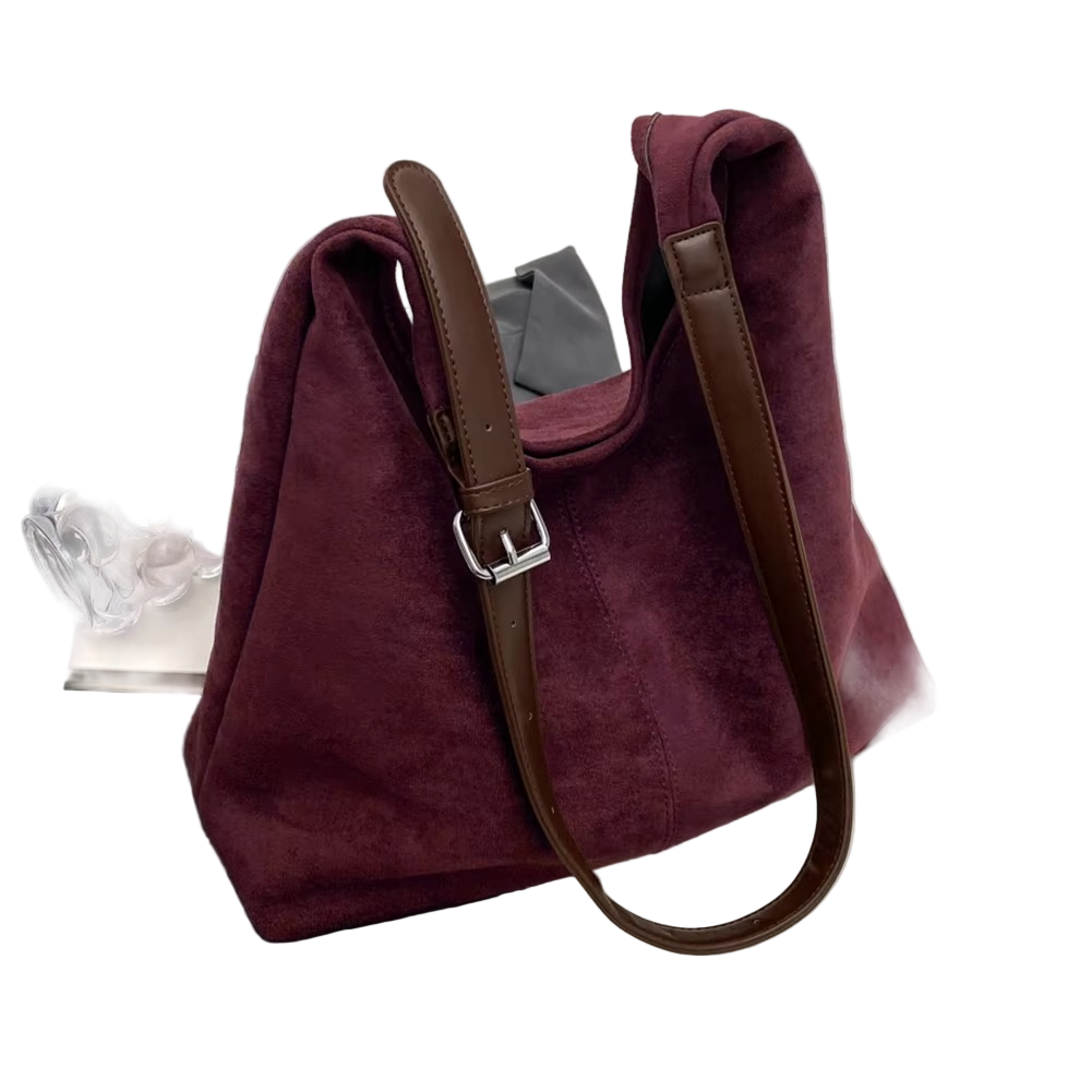 Chic damväska i boxig trunkstil med stabil form, perfekt för en elegant look och rymlig.