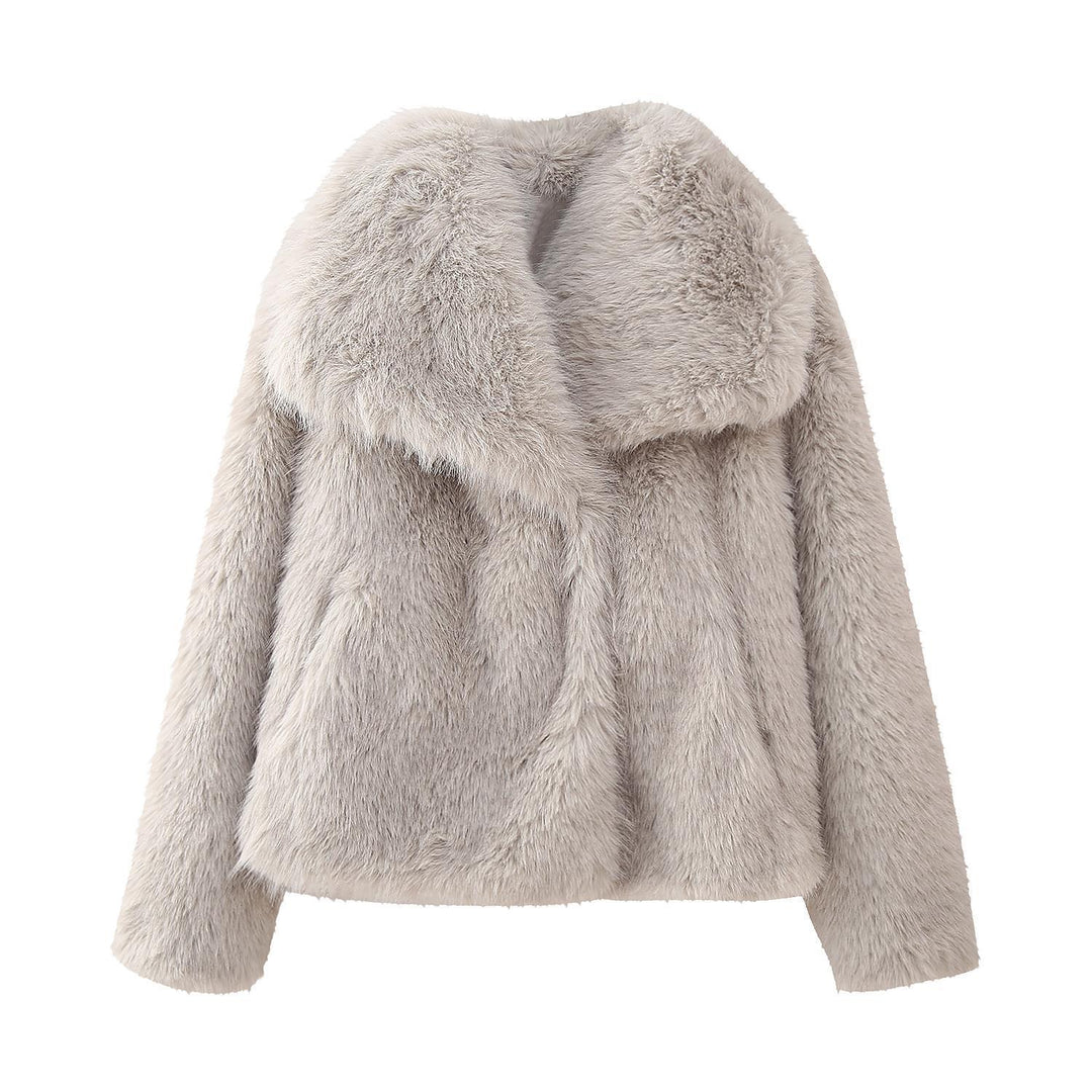 Elegant damjacka med lyxig fuskpälslook och praktisk dragkedja. Perfekt för höst och vinter.