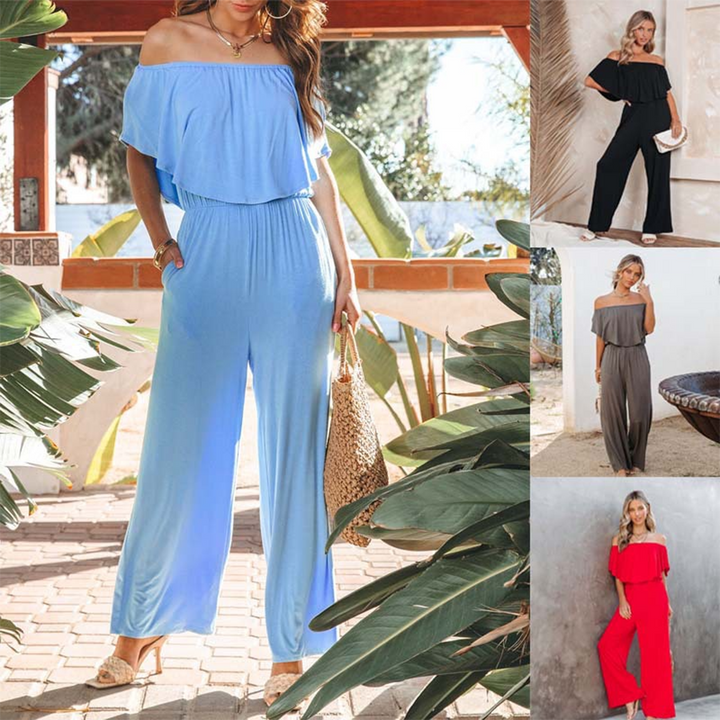 Stilfull dam byxdress med off shoulder och vida ben. Perfekt för sommarens eleganta fester och tillställningar.
