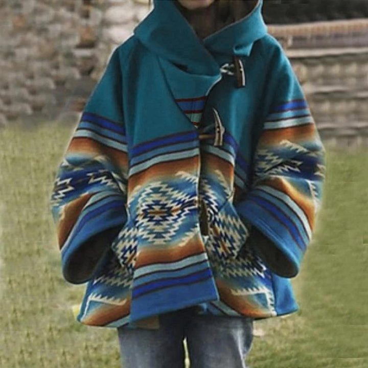 Stilren damkappa i färgglad design, perfekt som modekappa för kalla månader. Lång, varm & snygg.