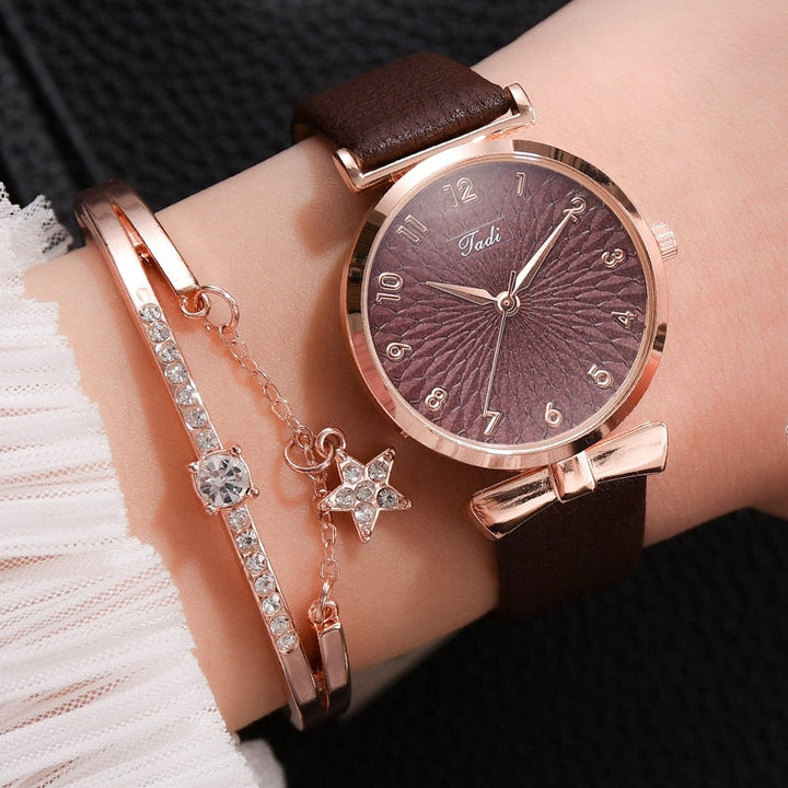 Elegant damklocka med minimal design och glittrande urtavla, en tidlös modeaccessoar.