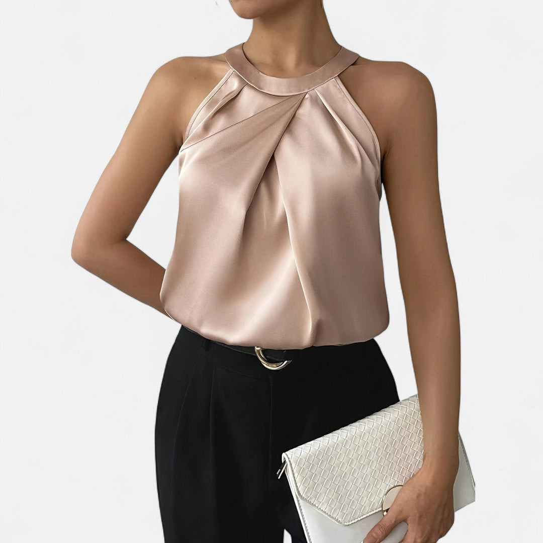 Sommar damlinne med sofistikerad plisserad front och draperad passform, ärmlöst.
