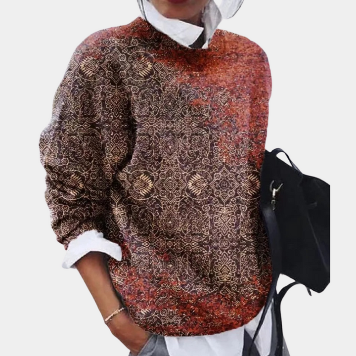 Närbild: Mönstrad stickad damtröja i vintagestil. Trendig och elegant för höst- och vintermode.