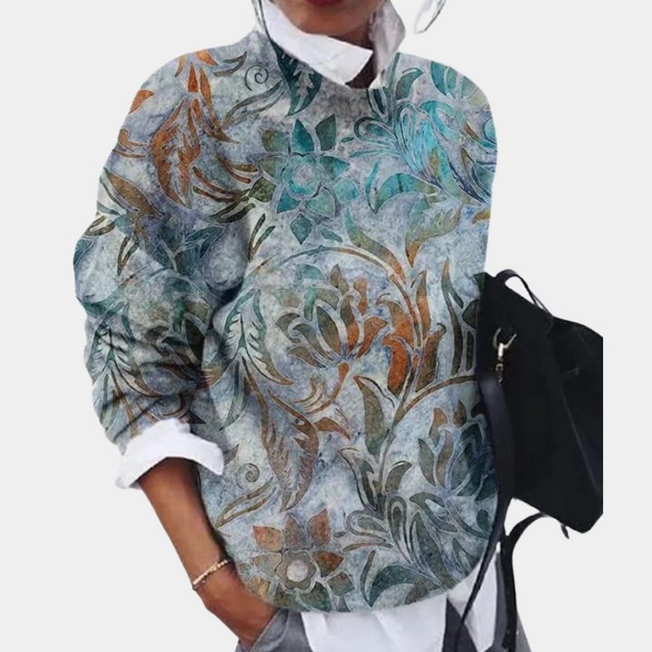 Modell bär elegant damtröja i vintagedesign. Bekväm stickad tröja, perfekt för trendigt höstmode.