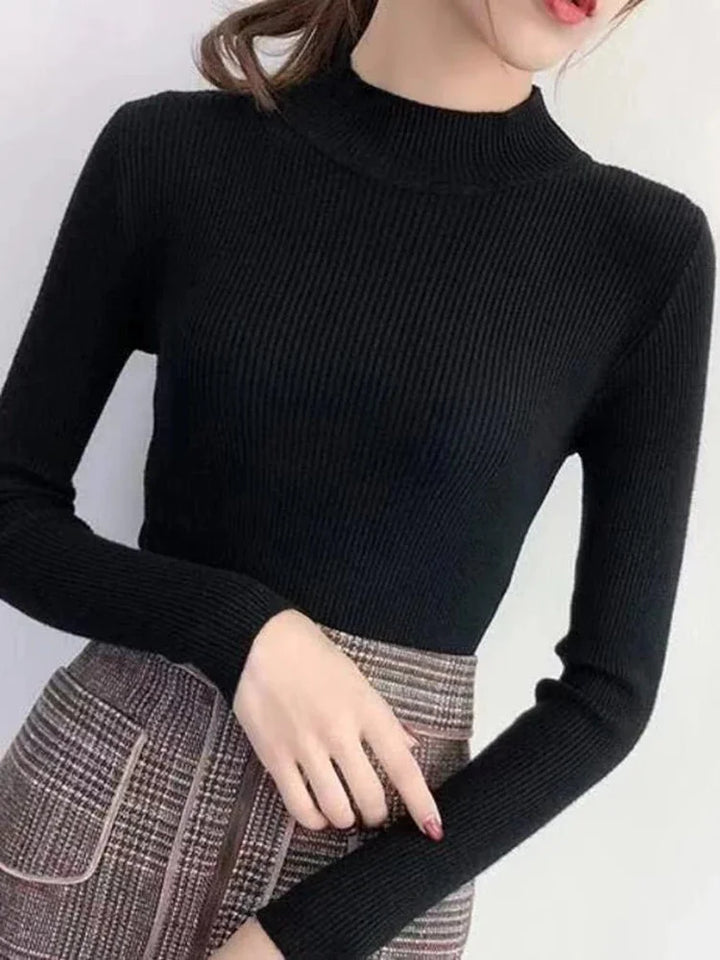 Damtröja i vintage stil med hög krage. En elegant och tidlös del av höstgarderoben.