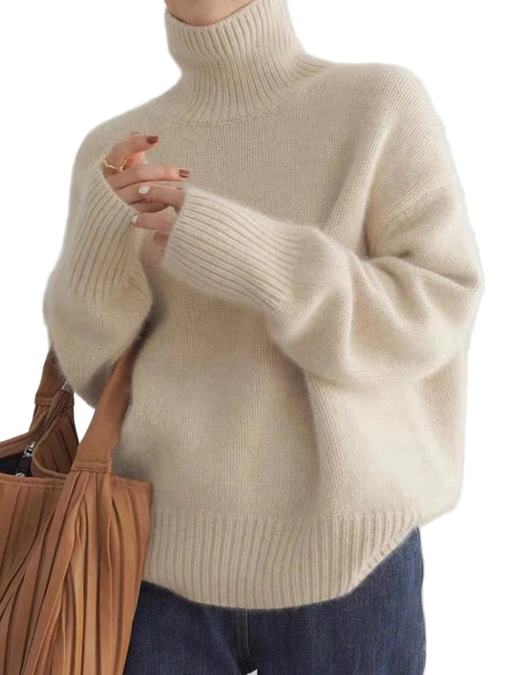 Elegant damtröja med turtleneck, perfekt för höst och vinter. Ger värme och stil med hög krage.