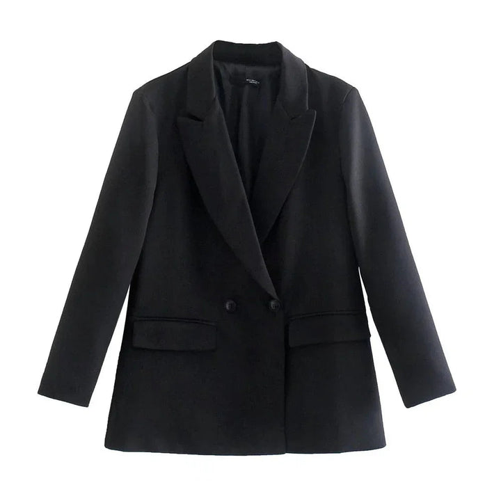 Kvinna bär en formell, strukturerad damkavaj. Elegant ytterplagg för en chic kontorslook.