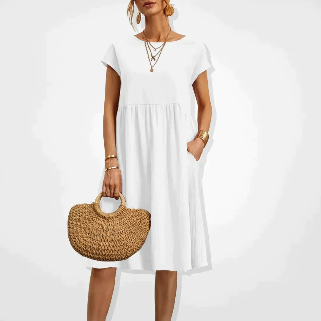Chic empire-damklänning, perfekt som midsommar- och festklänning. Utmärkt för sommarmode och elegans.