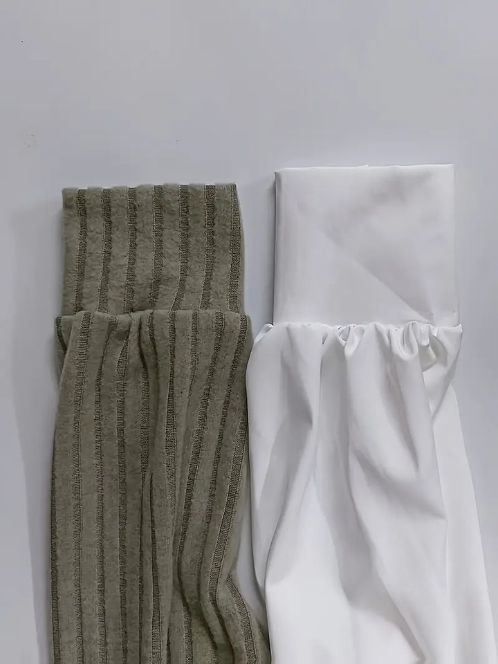Grön asymmetrisk damtopp, elegant och bekväm för både fest och vardag. Unik stil som lyfter kvinnors mode.