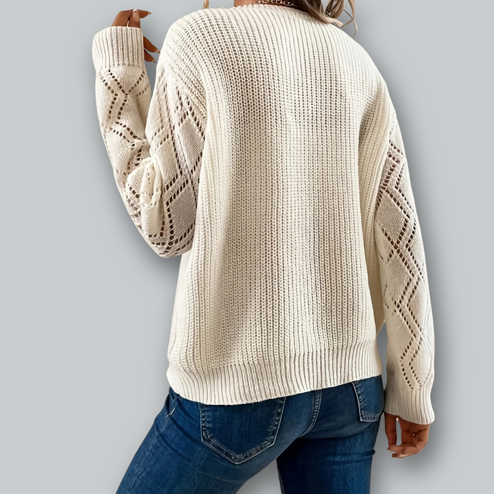 Kvinnors stickade pullover, v-ringad med eleganta ärmar. Modern damtröja i avslappnad och sofistikerad stil.