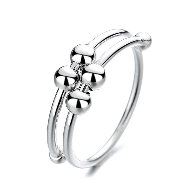 Elegant justerbar ångestring i silver för stresslindring, med roterande funktion, perfekt för kvinnor.