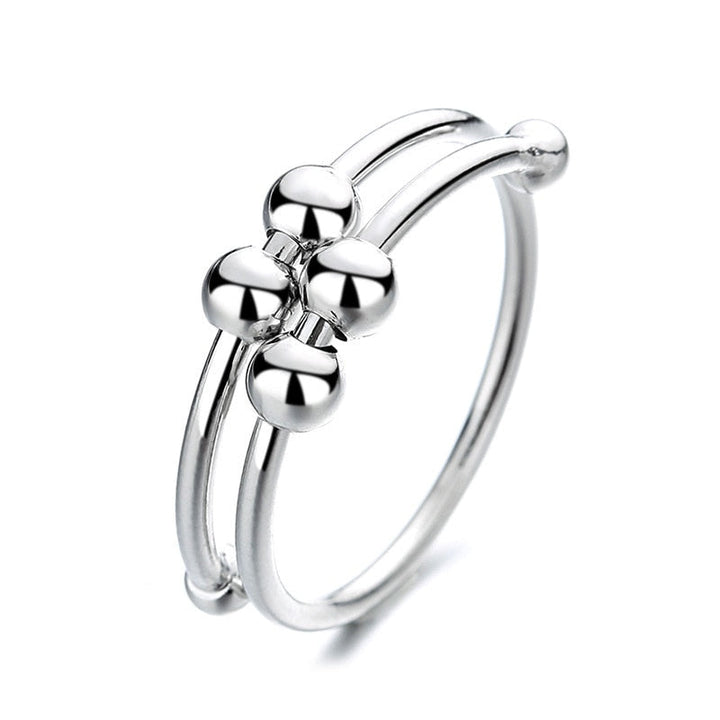Elegant justerbar ångestring i silver för stresslindring, med roterande funktion, perfekt för kvinnor.