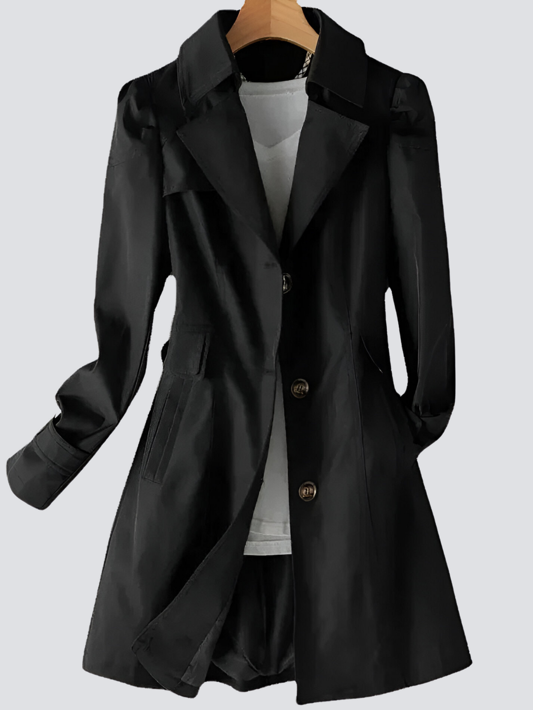 Klassisk kvinnors trenchcoat med bälte, elegant silhuett och dubbelknäppt design. Finns i flera färger.