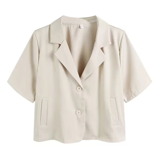 Kortärmad kontorsblazer för kvinnor. Elegant svart design, perfekt för professionell och snygg look.