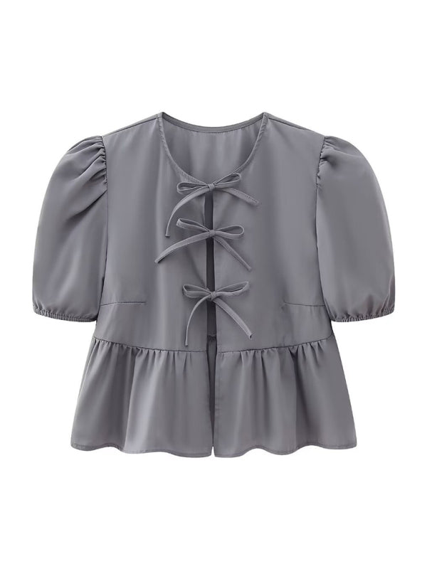 Vardags- & festtopp: figurnära modell med puffärmar & spaghettiband, en elegant touch till din outfit.