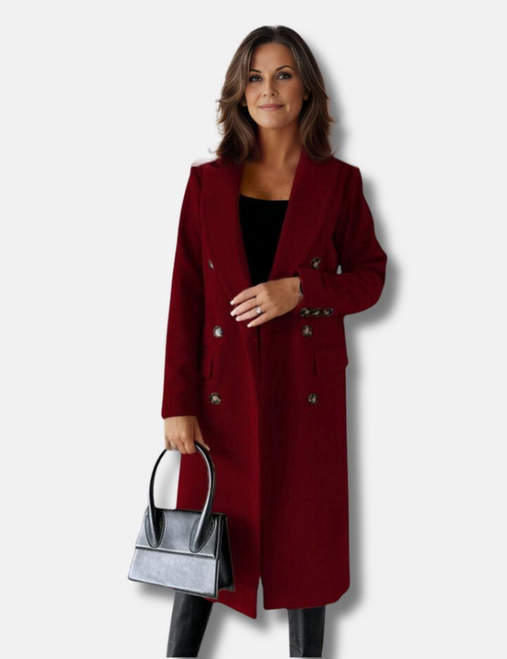 Stilren lång damkappa med dubbelknäppning. Ett elegant ytterplagg för kvinnors höstmode.