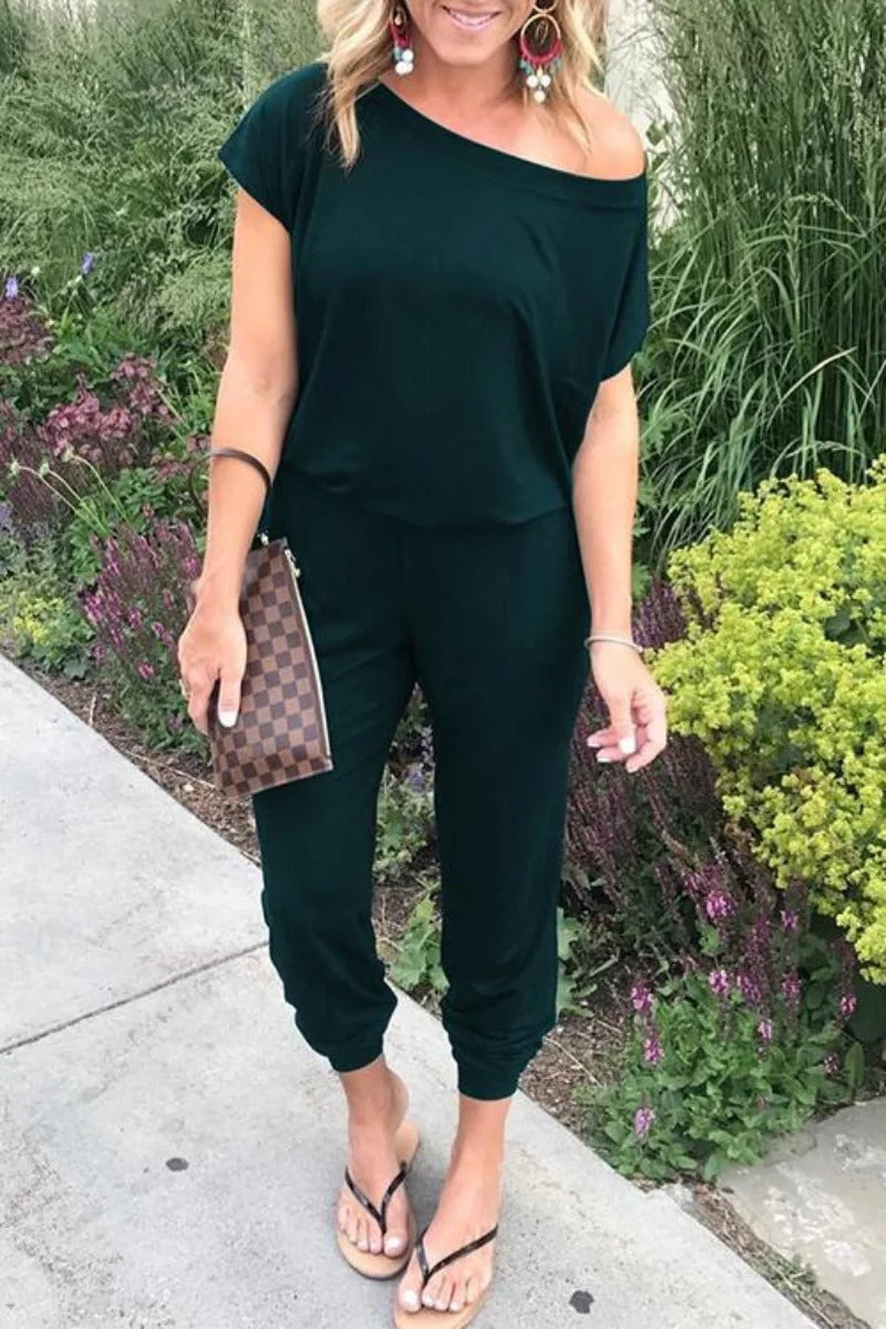 Bekväm damjumpsuit med haremsbyxkänsla och axelavslut. Lös passform för maximal komfort och stil.