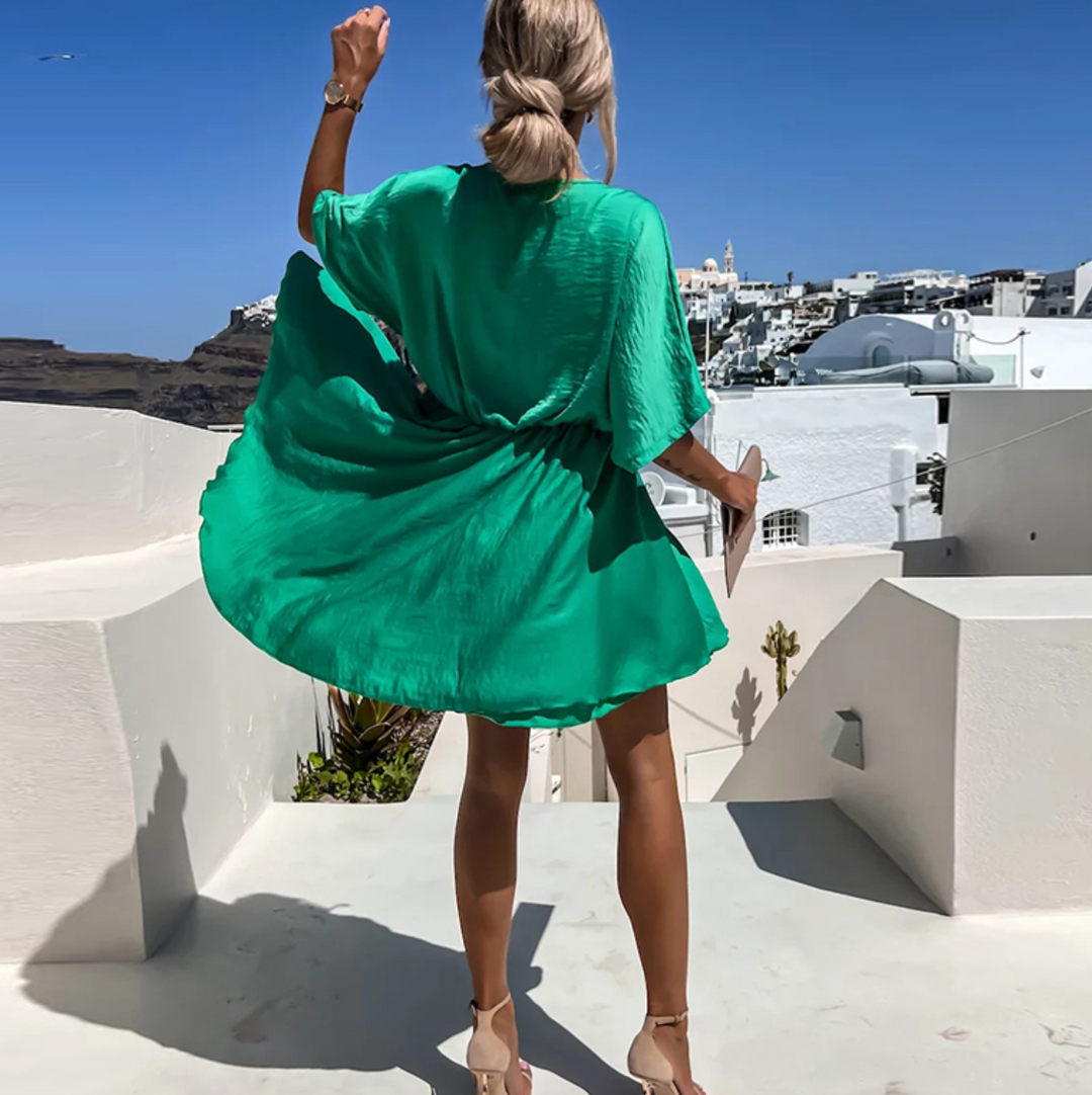 Mångsidig dam sommarklänning som passar både elegant fest och avslappnad vardagslook i bomull.
