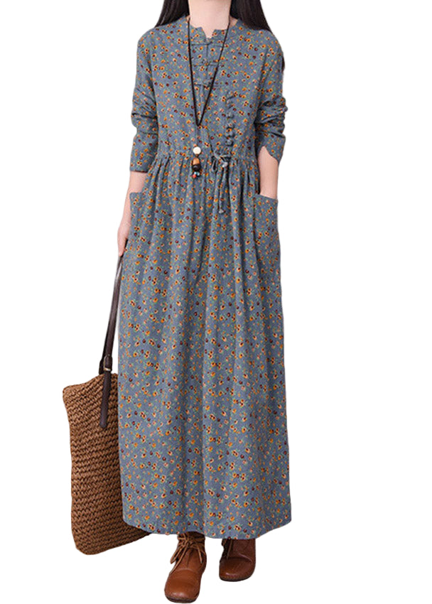 Elegant mönstrad damklänning med O-hals och chic knytning i midjan, perfekt för vår och sommar.