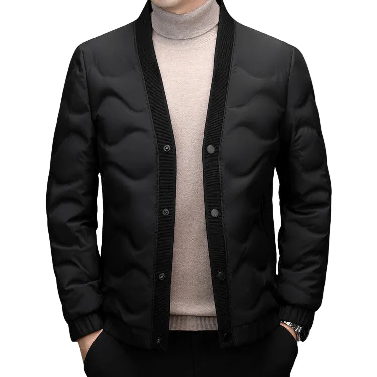 Elegant minimalistisk dunjacka för herrar. Stilren, varm och perfekt för vinterns kalla dagar.