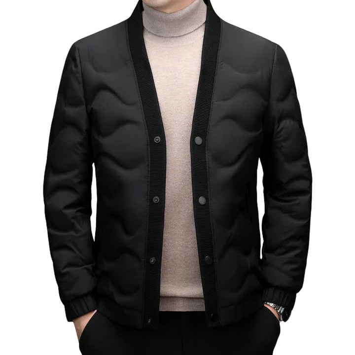 Elegant minimalistisk dunjacka för herrar. Stilren, varm och perfekt för vinterns kalla dagar.