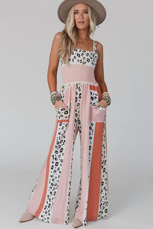 Orange bredbenad jumpsuit för kvinnor med spaghettiband. Stilren och bekväm dam byxdress för alla tillfällen, vardag som fest.