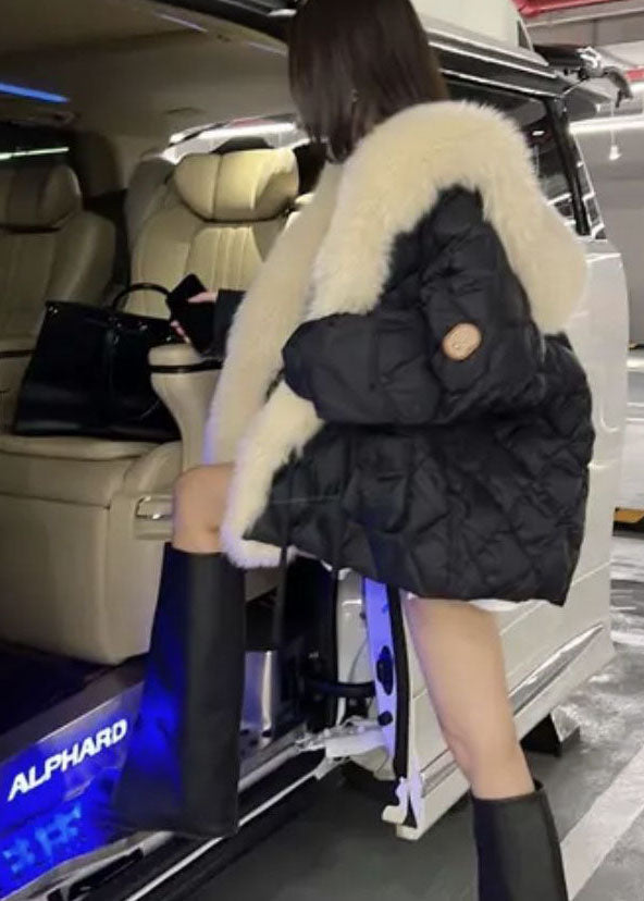 Lyxig oversized vinterjacka för dam, med mjuk fuskpäls som ger både värme och elegant stil.