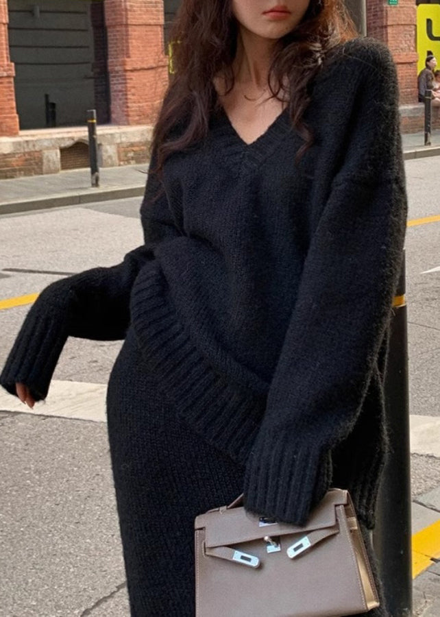 Moderna plus size kläder: tvådelat set med elegant tröja och smickrande maxikjol. Finns i brunt/svart.