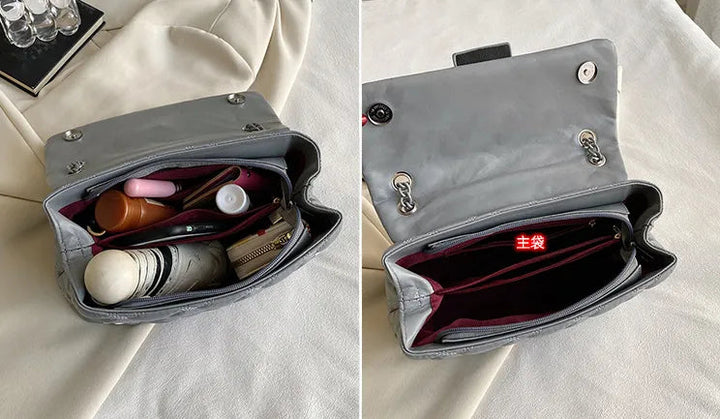 Chic quiltad handväska med framträdande örndetalj, en lyxig damväska för fashionistas.