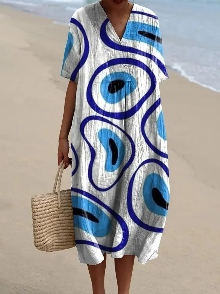 Skön ankellång damklänning i randig färgblock, elegant vardagslook, perfekt för sommar.