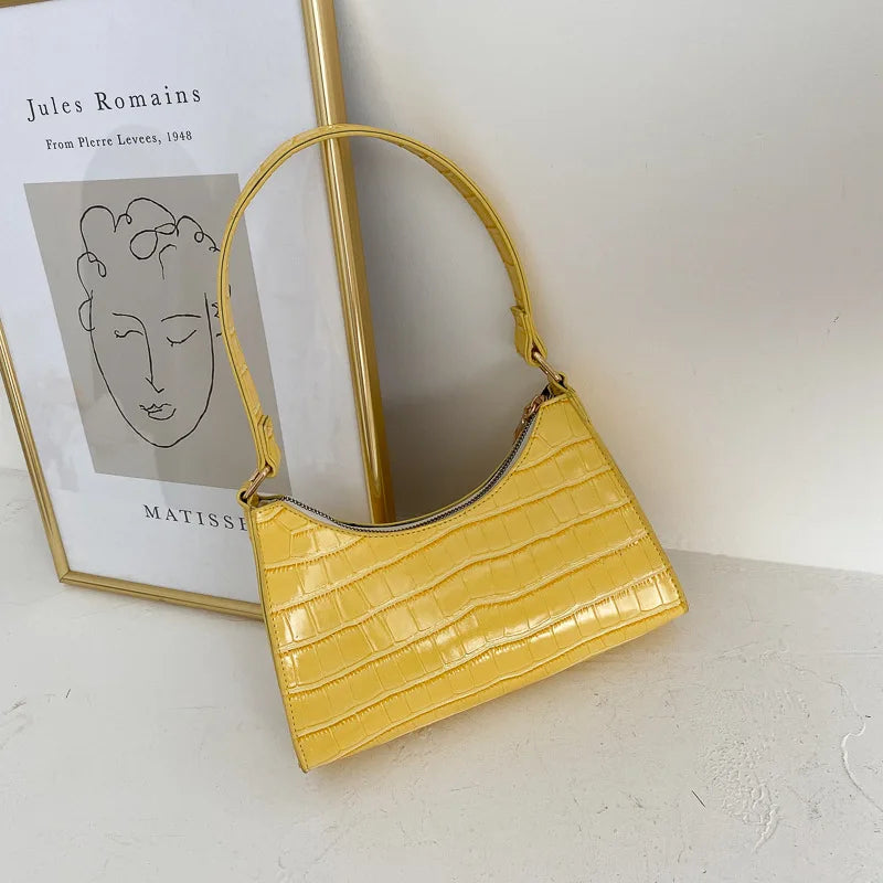 Damaxelväska med elegant retrokänsla, perfekt accessoar för en sofistikerad look.