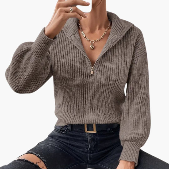 Ribbstickad damtröja med halvzip, långärmad och bekväm, för en elegant ledig look.