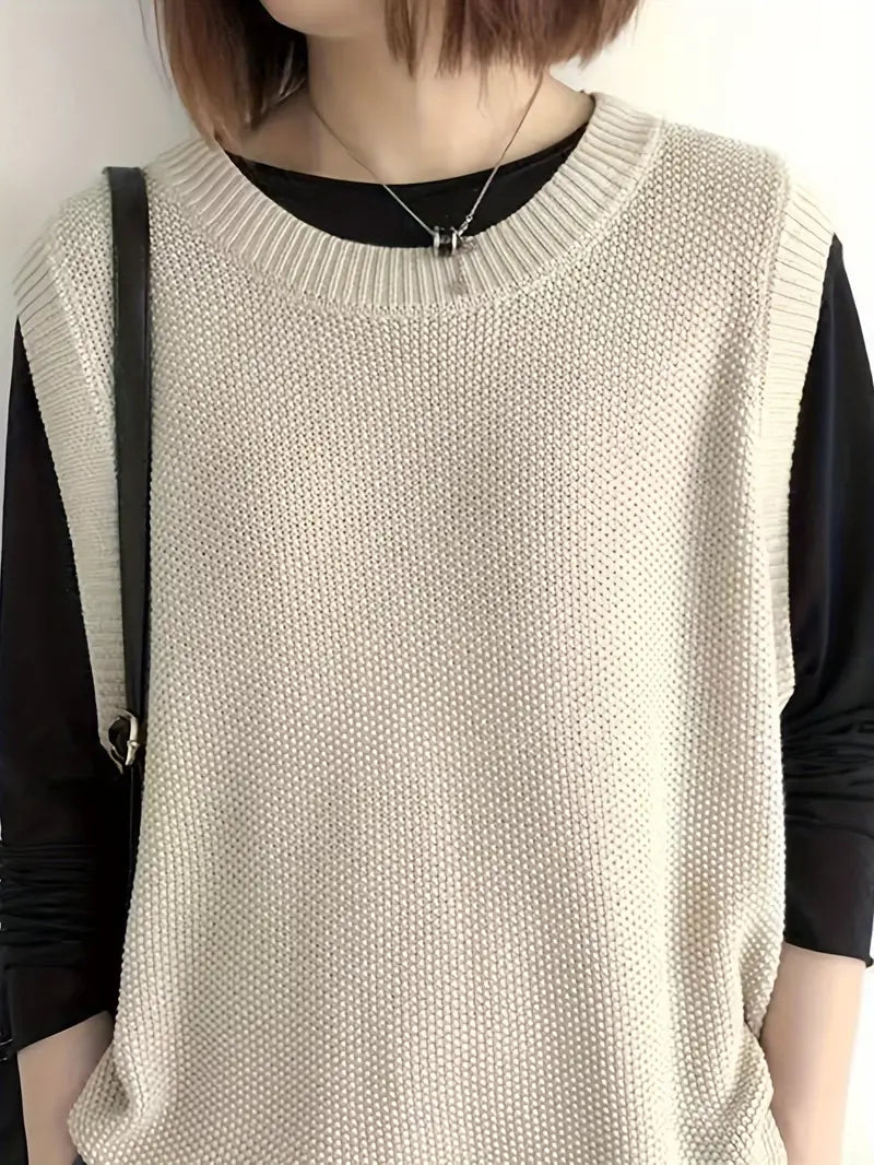 Ärmlös damtopp med rund hals, elegant och stilren. Bekväm modern chic tröja för kvinnor.
