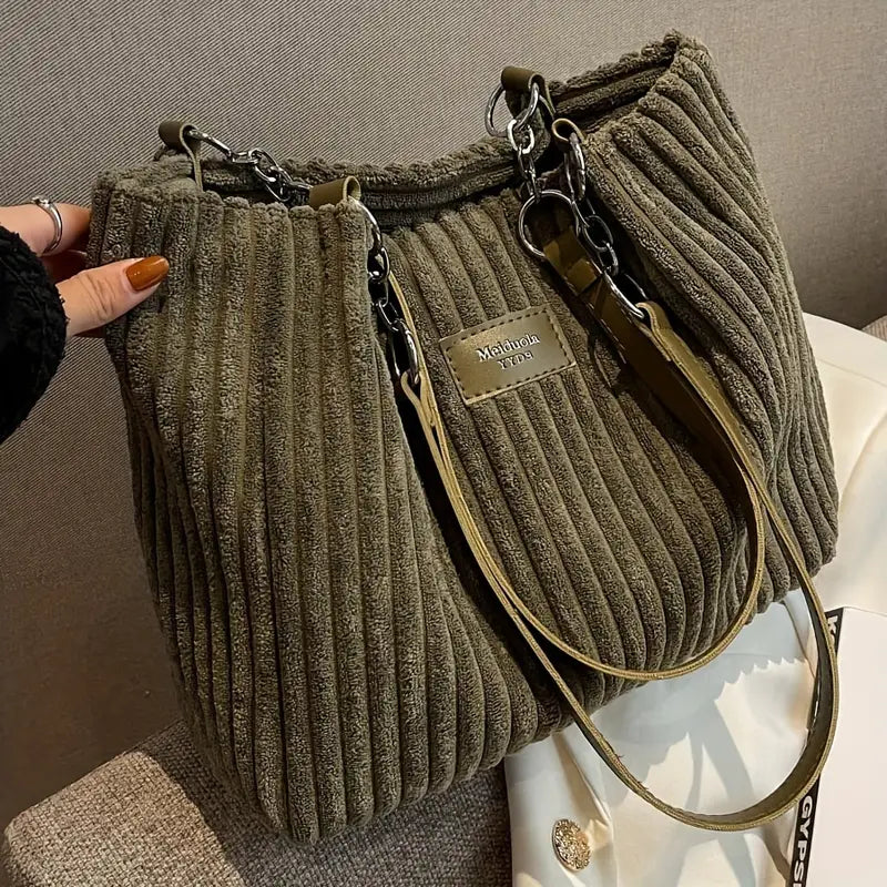 Minimalistisk shopper handväska för kvinnor. Rymlig axelväska med elegant design, idealisk för mode och vardagsbruk.