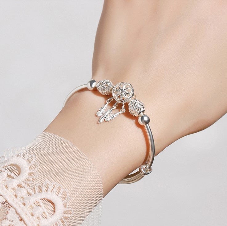Lyxigt sterling silver damarmband, med en delikat drömfångare som huvudmotiv.