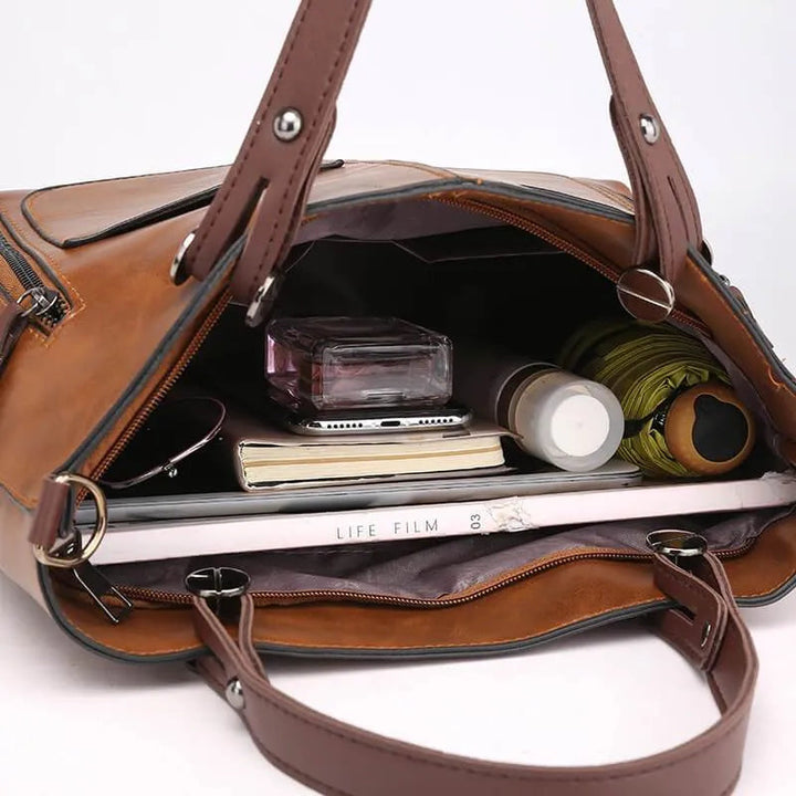 Klassisk elegant axelväska som damaccessoar. Stilren handväska för kvinnor, både praktisk och modern.