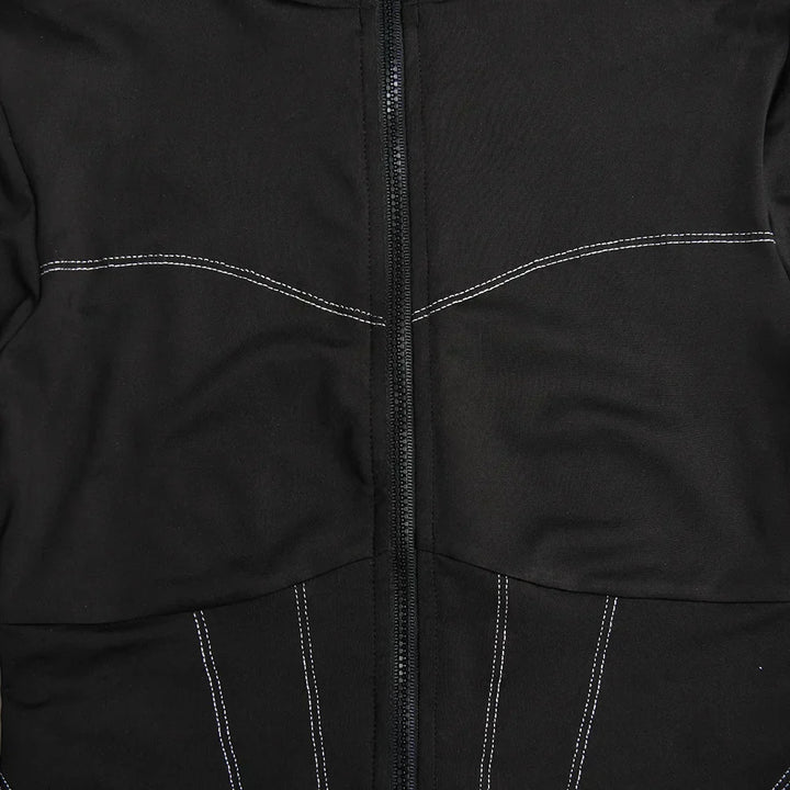 Stilren svart dam jumpsuit med smal passform, o-hals och långa ärmar. Mångsidig för både kvälls- och vardagsbruk.