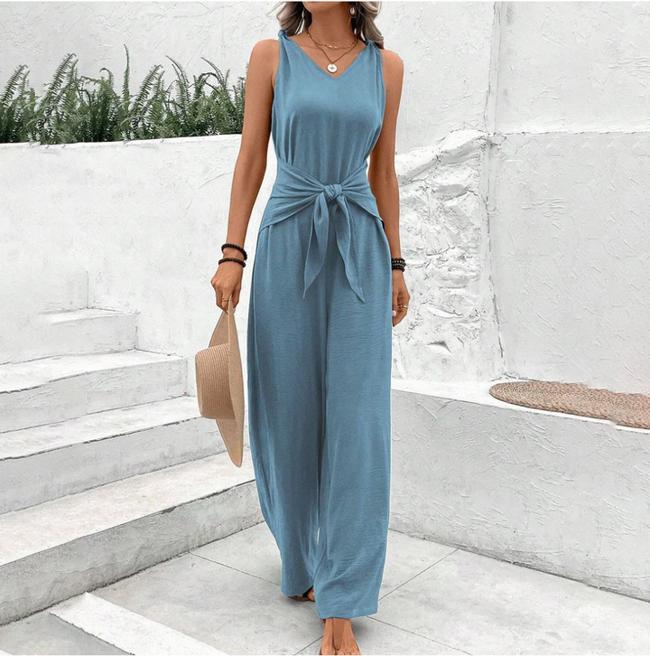 Elegant svart dam byxdress med V-ringning och breda ben, perfekt för sommarfester och bekväma vardagslooks.