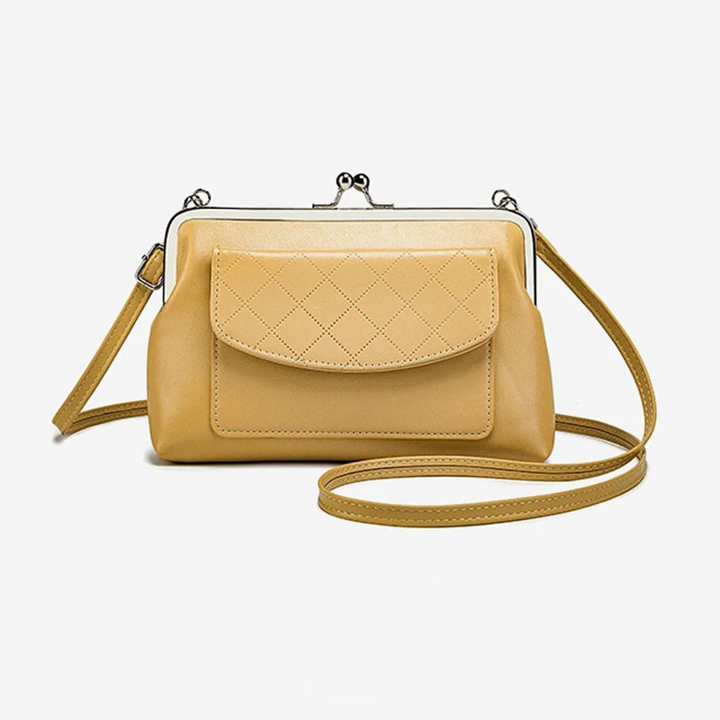 Trendig kompakt crossbodyväska för dam med stilren design och praktisk läppstängning. Perfekt för vardag/kväll.
